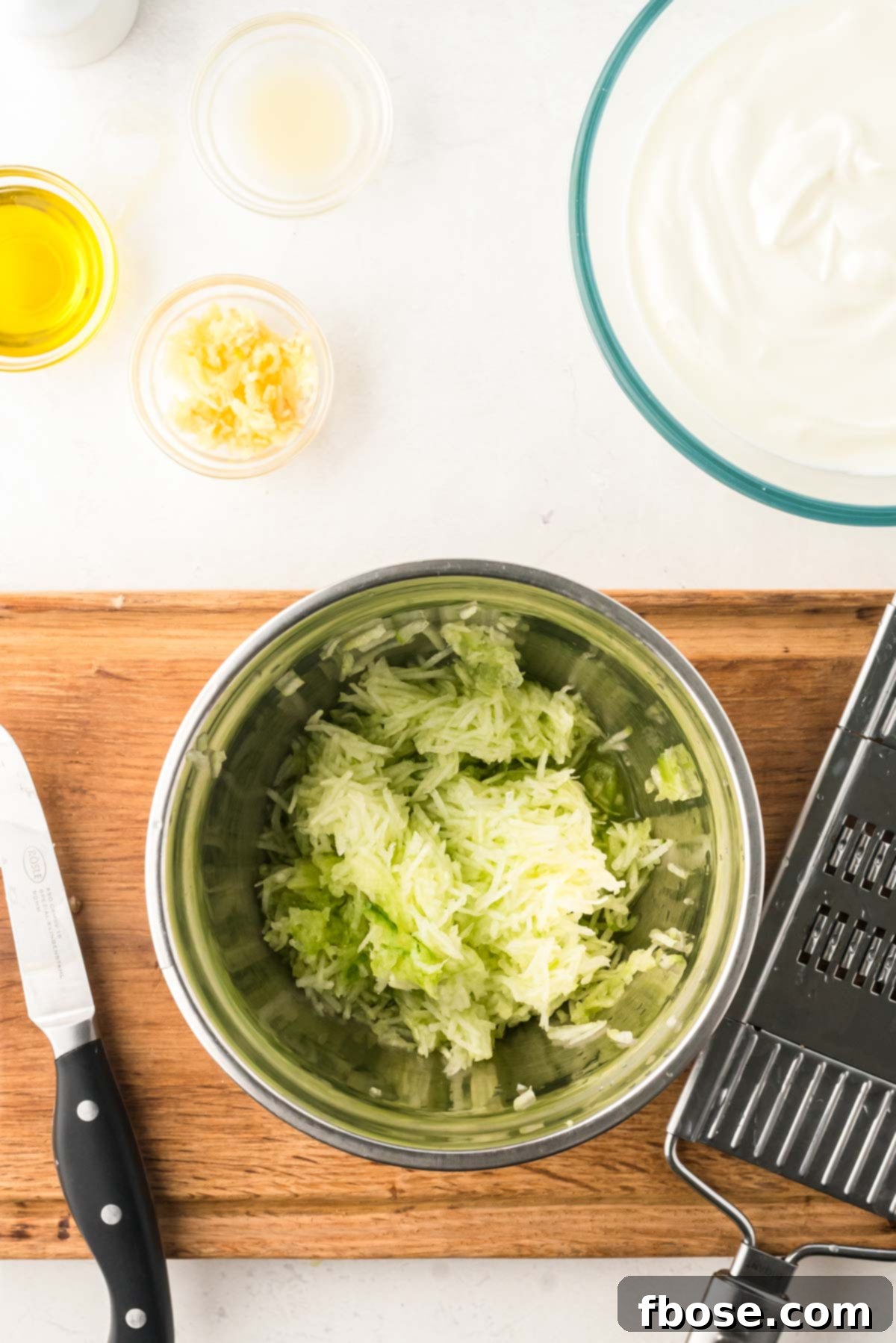Creamy Greek Cucumber Tzatziki 4 Overhead photo of ingredients to make Tzatziki sauce.