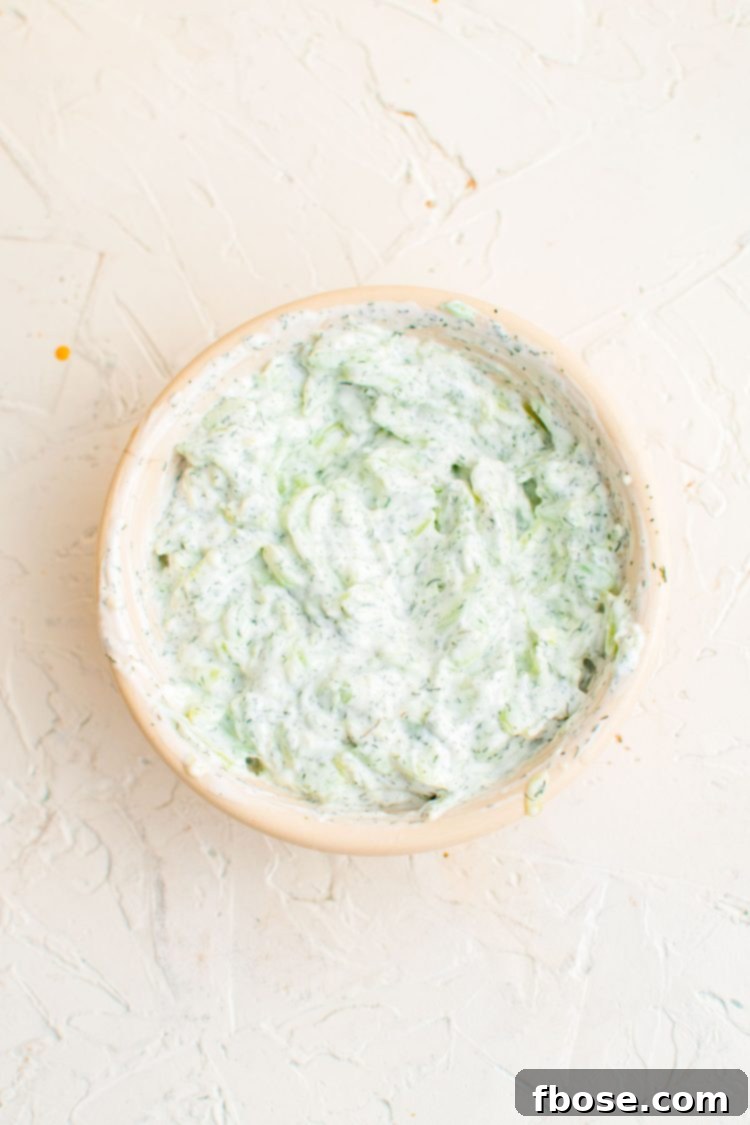 Tzatziki sauce in a white bowl.