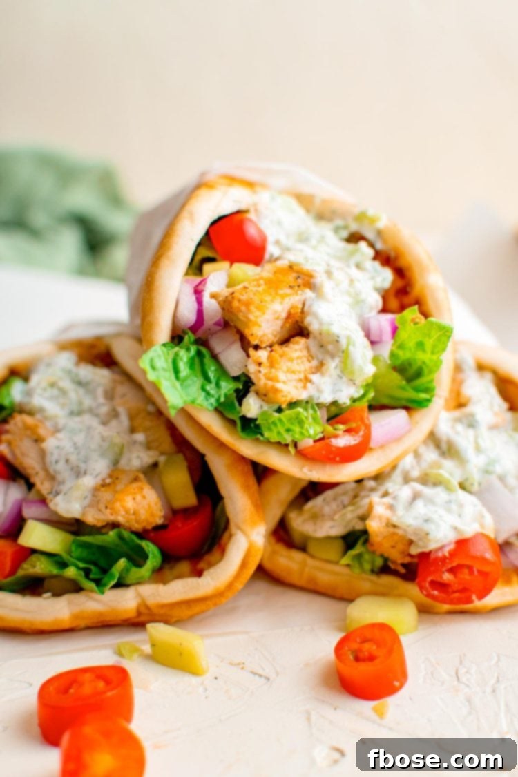Close up photo of three chicken gyros.