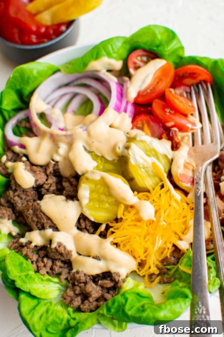 Close up photo of burger bowl with a fork in it.