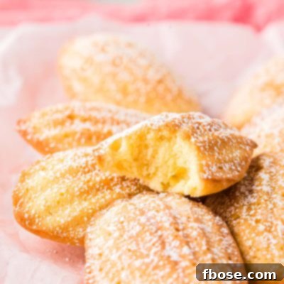 Close up photo of French Madeleines on a pink napkin.