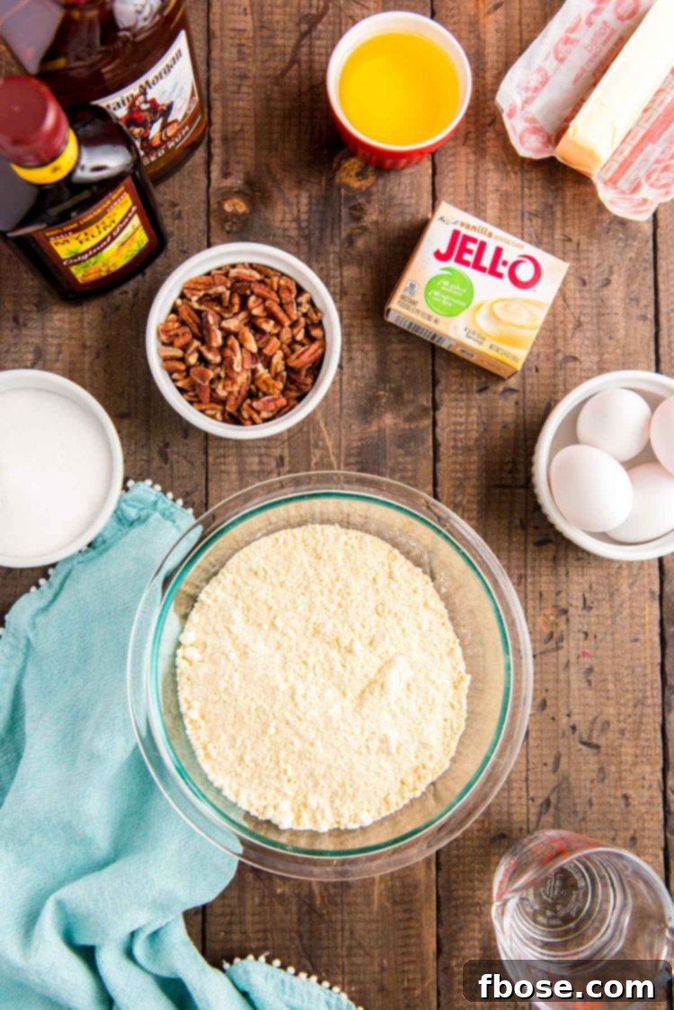 Overhead photo of ingredients to make rum bundt cake on a wooden table.