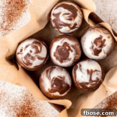Overhead photo of mocha hot chocolate bombs in a pan with parchment paper.
