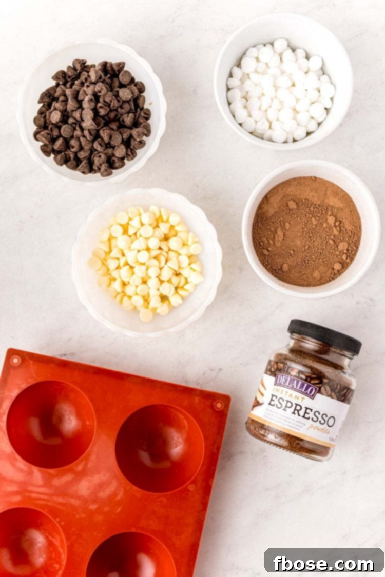 Overhead photo of ingredients to make mocha hot chocolate bombs on a white table.