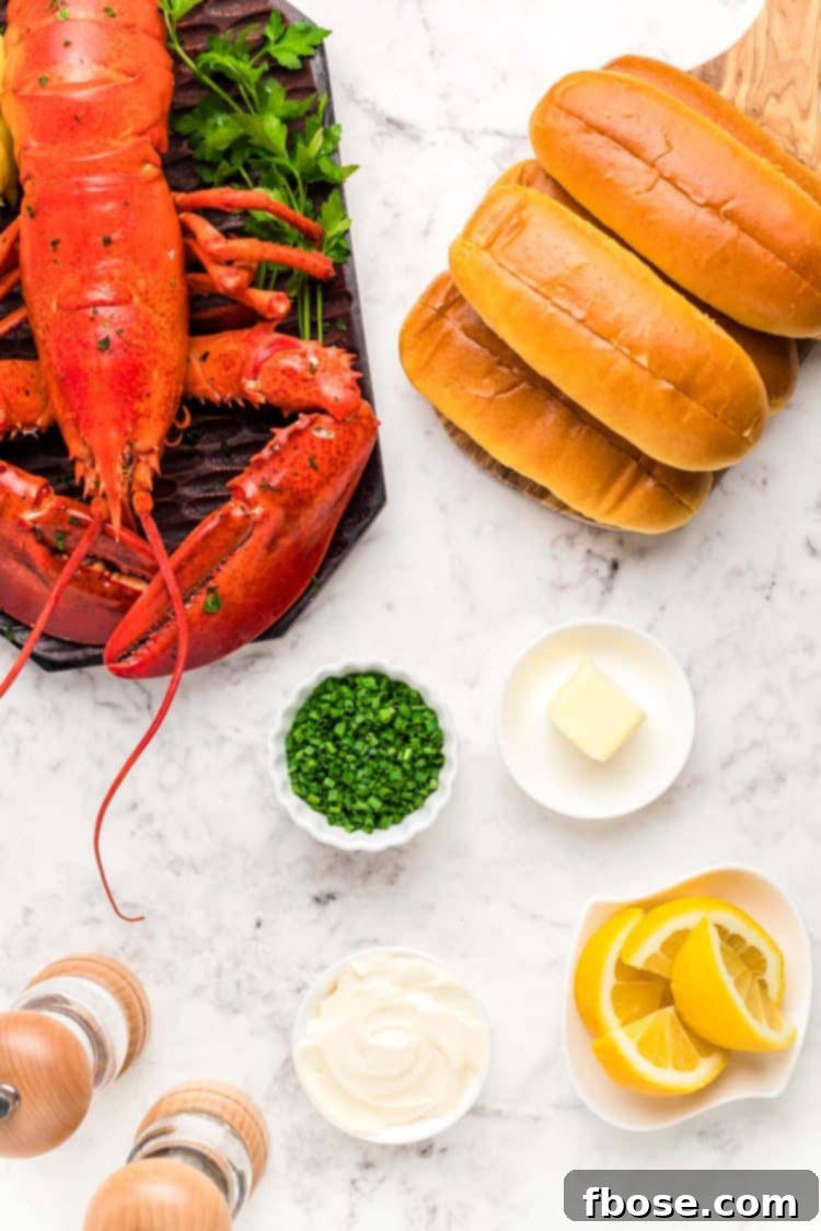 Ingredients to make a lobster roll on a marble surface.