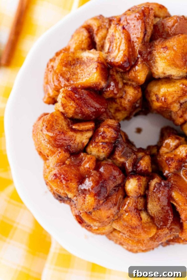 Overhead photo of a freshly baked air fryer monkey bread, glistening with cinnamon sugar.