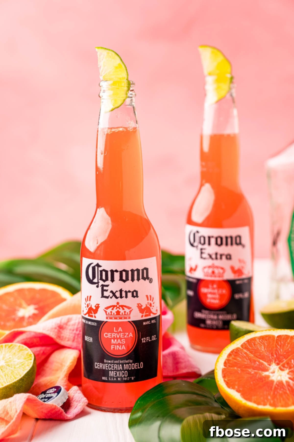 TikTok's Horizon Brew 2 Close up photo of a Corona sunrise in a Corona bottle with citrus and palm leaves around it.