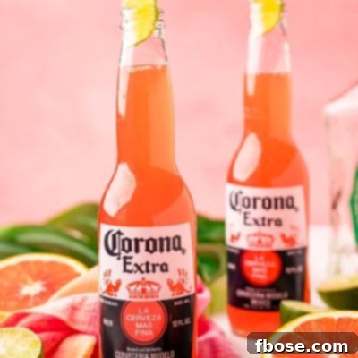 TikTok's Horizon Brew 7 Close up photo of a Corona sunrise in a Corona bottle with citrus and palm leaves around it.