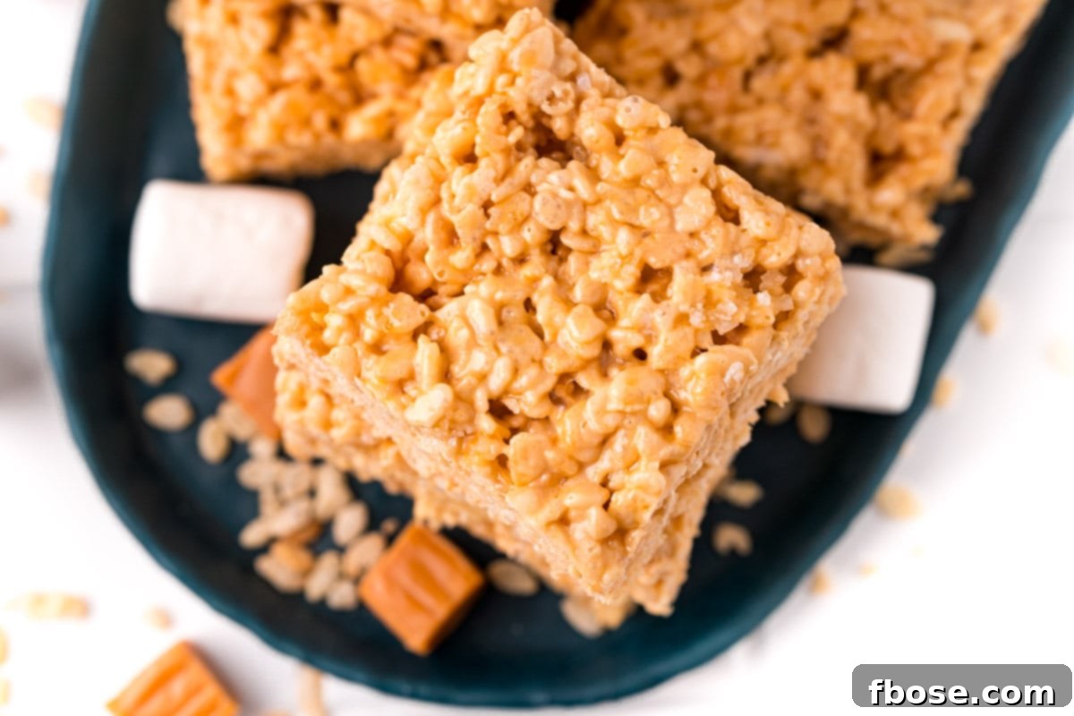 Salty-Sweet Caramel Crunch Bars 6 Overhead photo of a stack of salted caramel rice krispie treats.