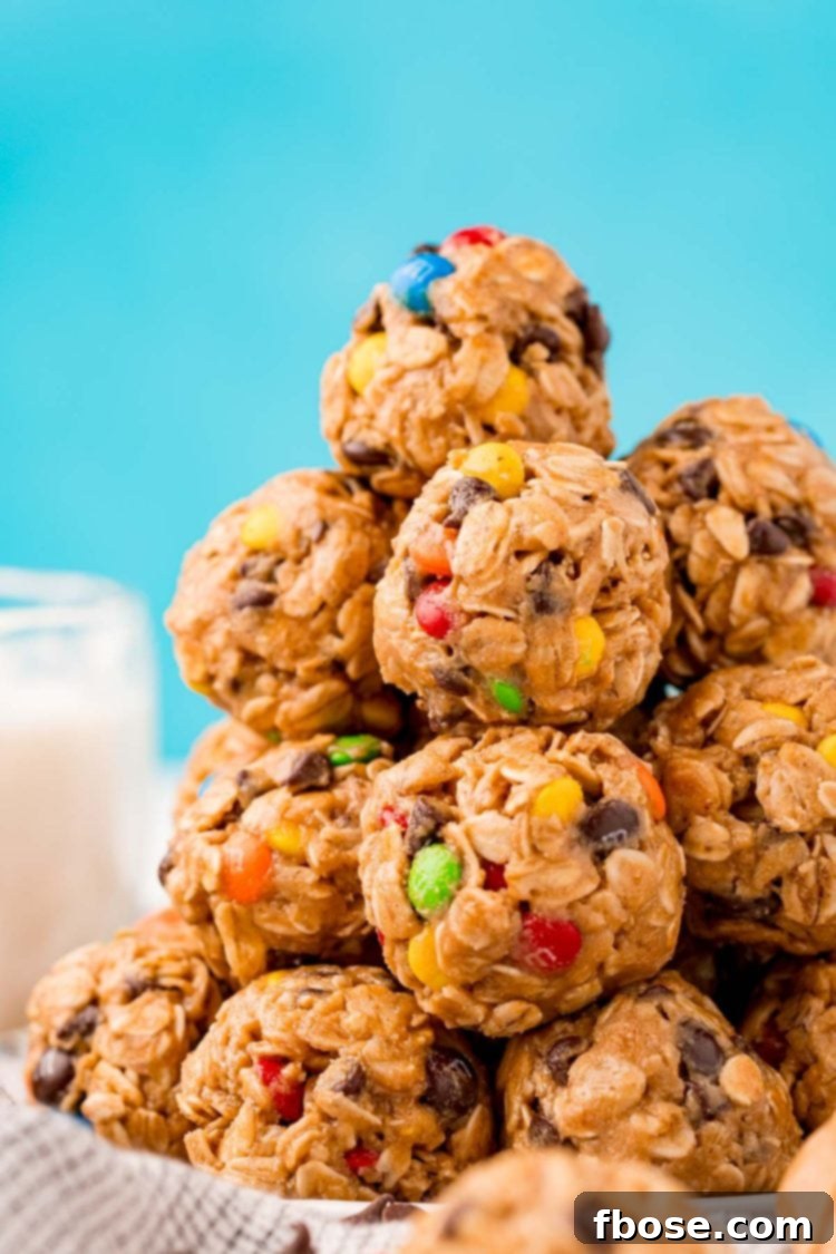 Close up photo of a stack of Monster Cookie Protein balls, showcasing the M&Ms and chocolate chips.