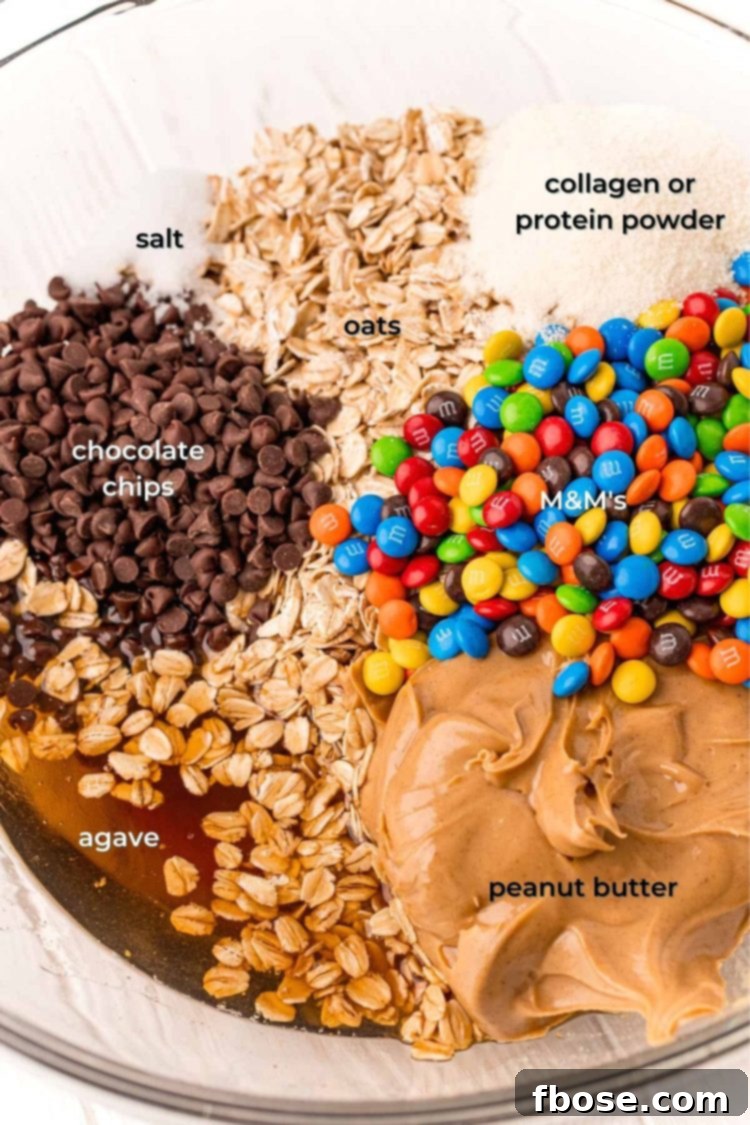 Ingredients for monster cookie balls in a mixing bowl, ready to be combined.