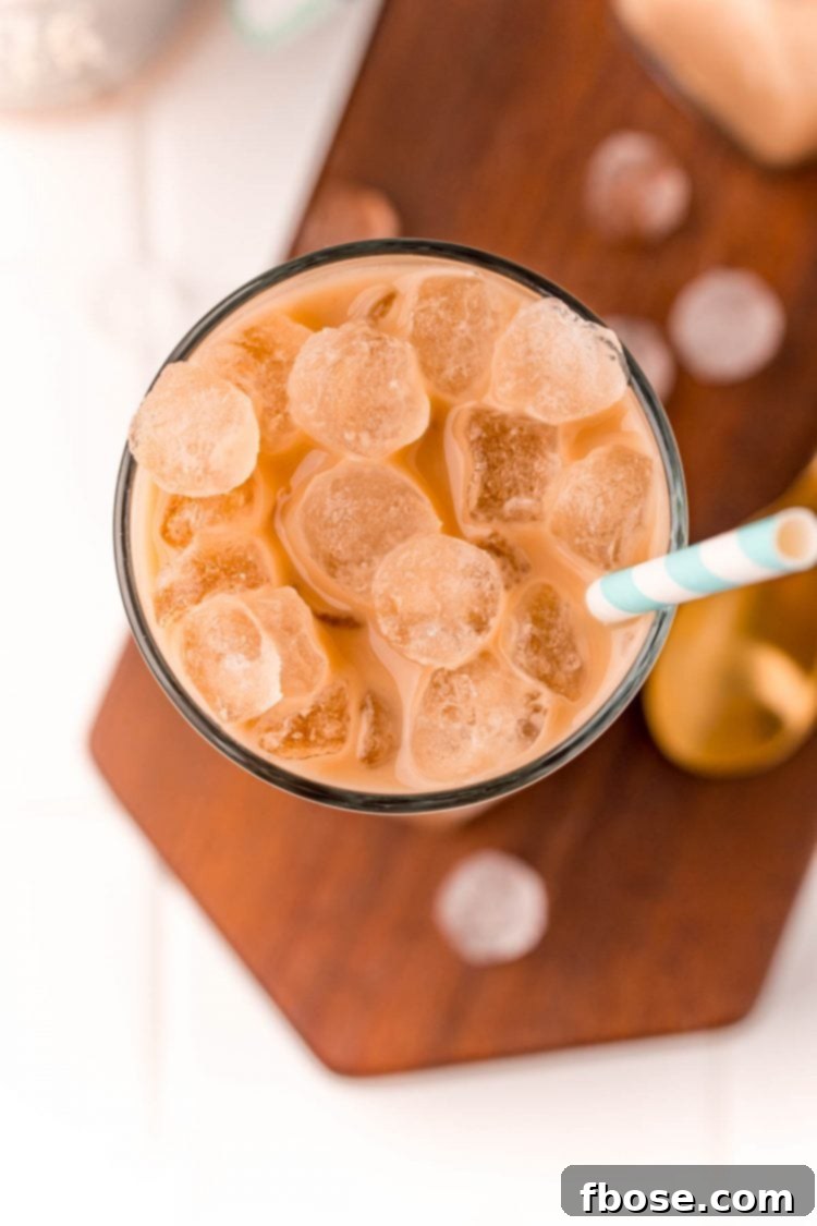 The Viral TikTok Starbucks Secret Cookie Butter Latte 4 Overhead photo of a glass with an iced latte in it.