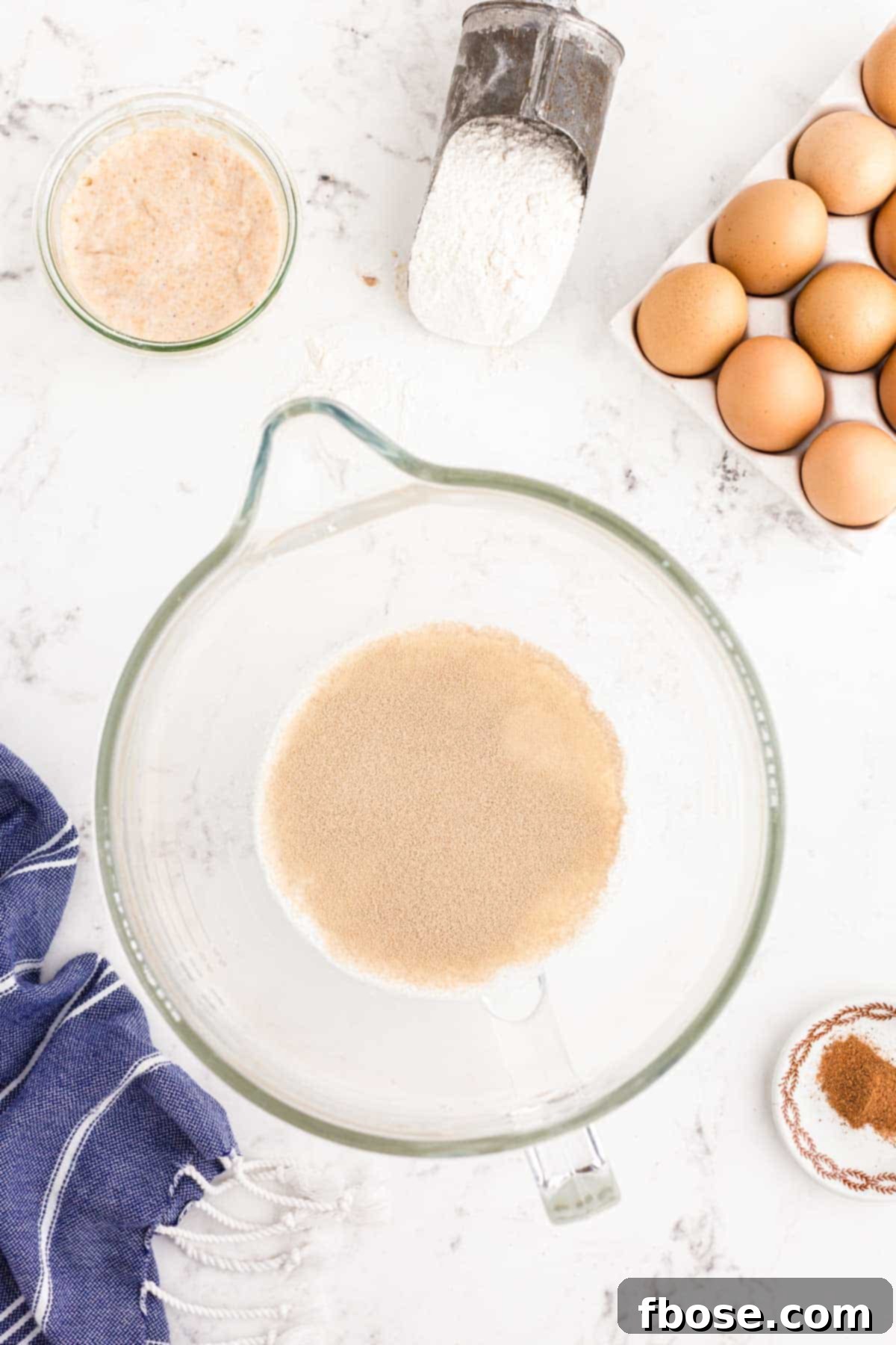 Yeast blooming in a mixing bowl.