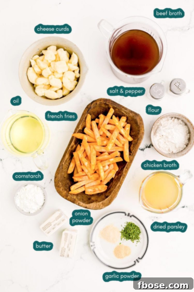 Overhead photo of ingredients to make poutine on a marble surface.