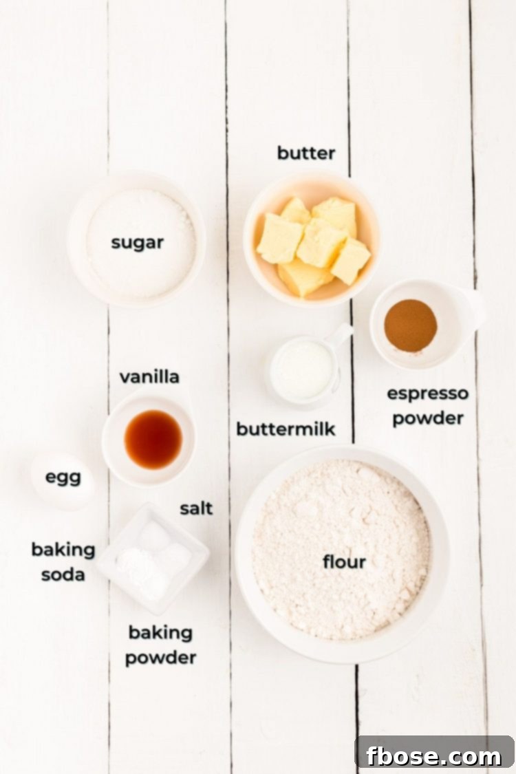 Brewed & Baked 4 Overhead photo of all the prepared ingredients laid out on a white wooden table, ready to be combined for making homemade coffee donuts.