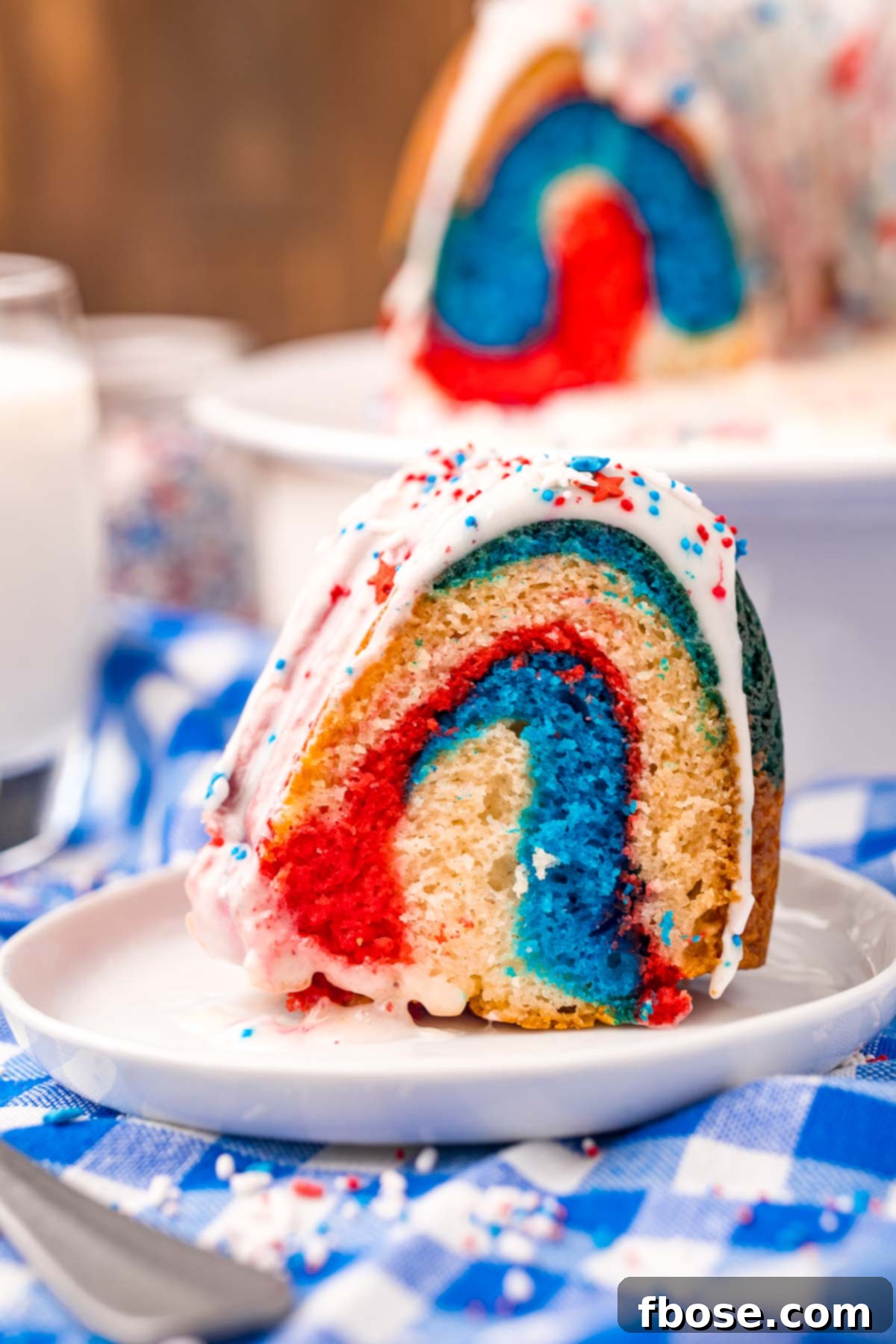 Photo of red white and blue bundt cake, showcasing the finished decorated dessert.