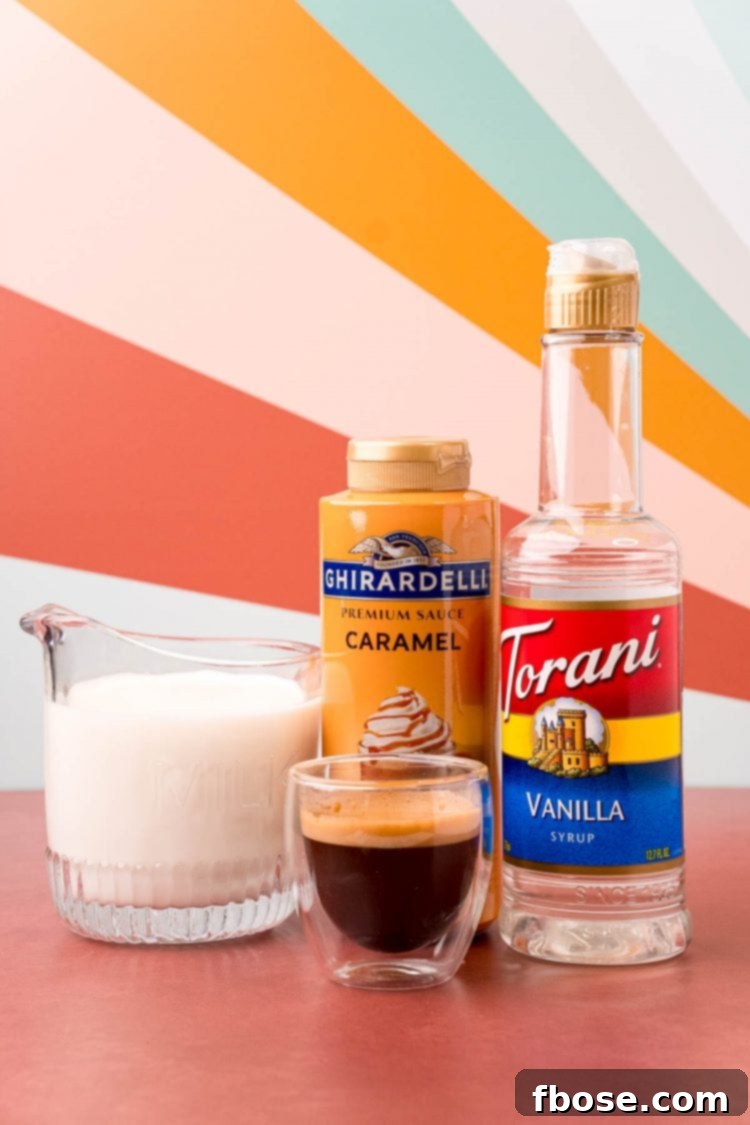 Ingredients to make an iced caramel macchiato on a red surface.