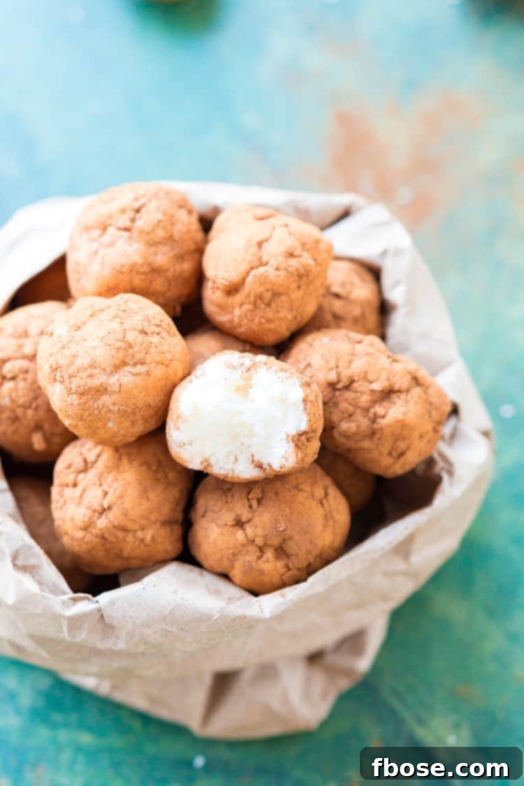 This Irish Potato Candy is perfect for celebrating St. Patrick's Day with! Made from coconut, cream cheese, sugar, and cinnamon and look like potatoes!