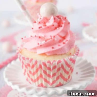 Strawberry Milkshake Cupcakes with pink frosting and Whoppers