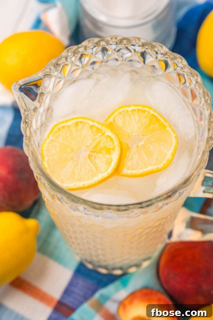 Close up photo of a pitcher or peach lemonade.