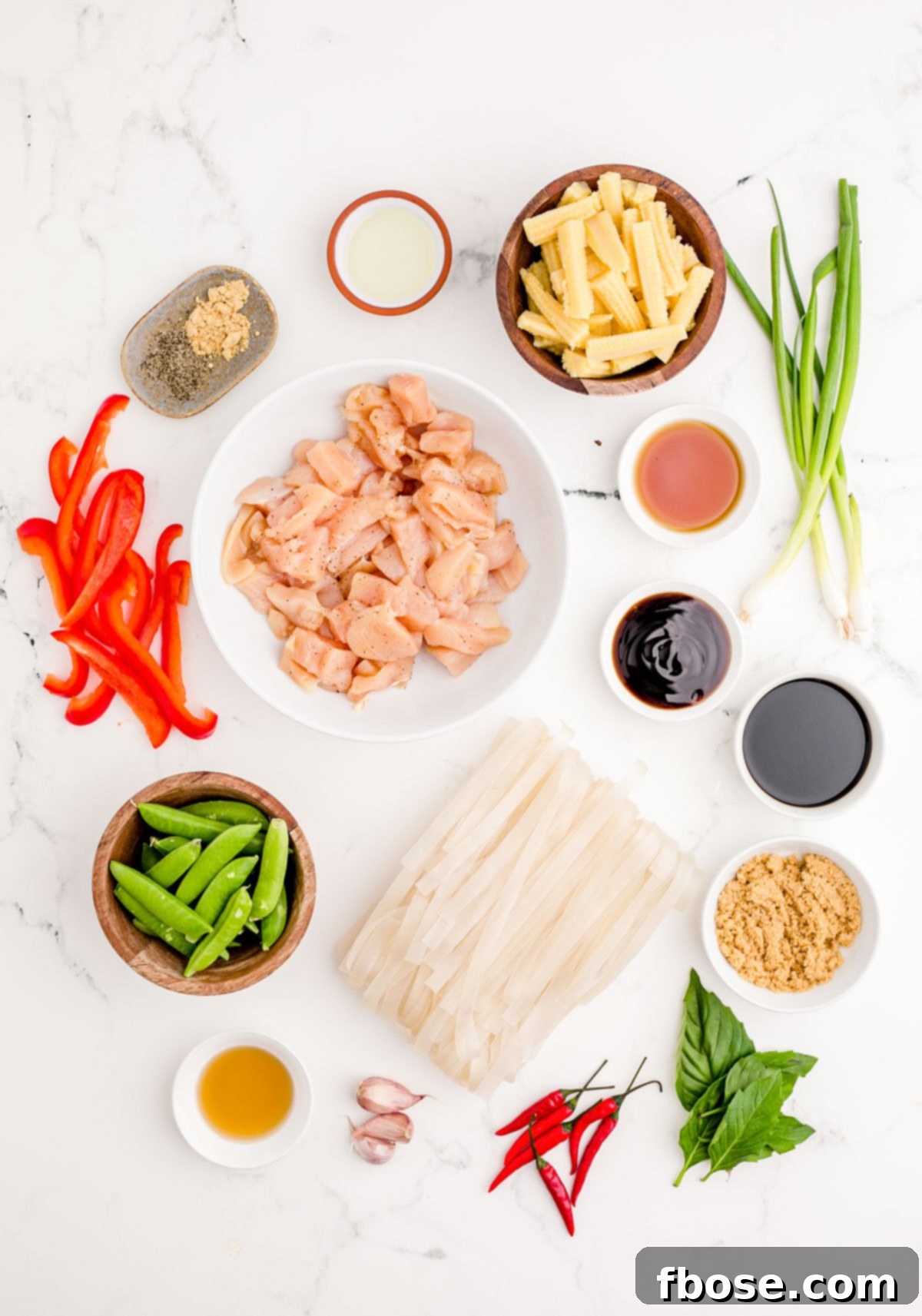 Overhead photo of Drunken Noodles on a marble counter, ready to be served.