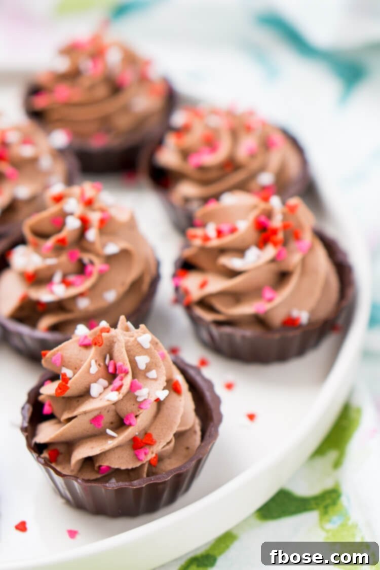 Decadent Four Ingredient Chocolate Mousse Cups 6 Chef's hand piping chocolate mousse into a Belgian chocolate cup, demonstrating the ease of preparation.