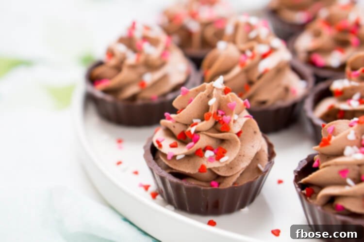 Decadent Four Ingredient Chocolate Mousse Cups 7 Decorated 4-Ingredient Chocolate Mousse Cups ready to be enjoyed, with festive sprinkles.