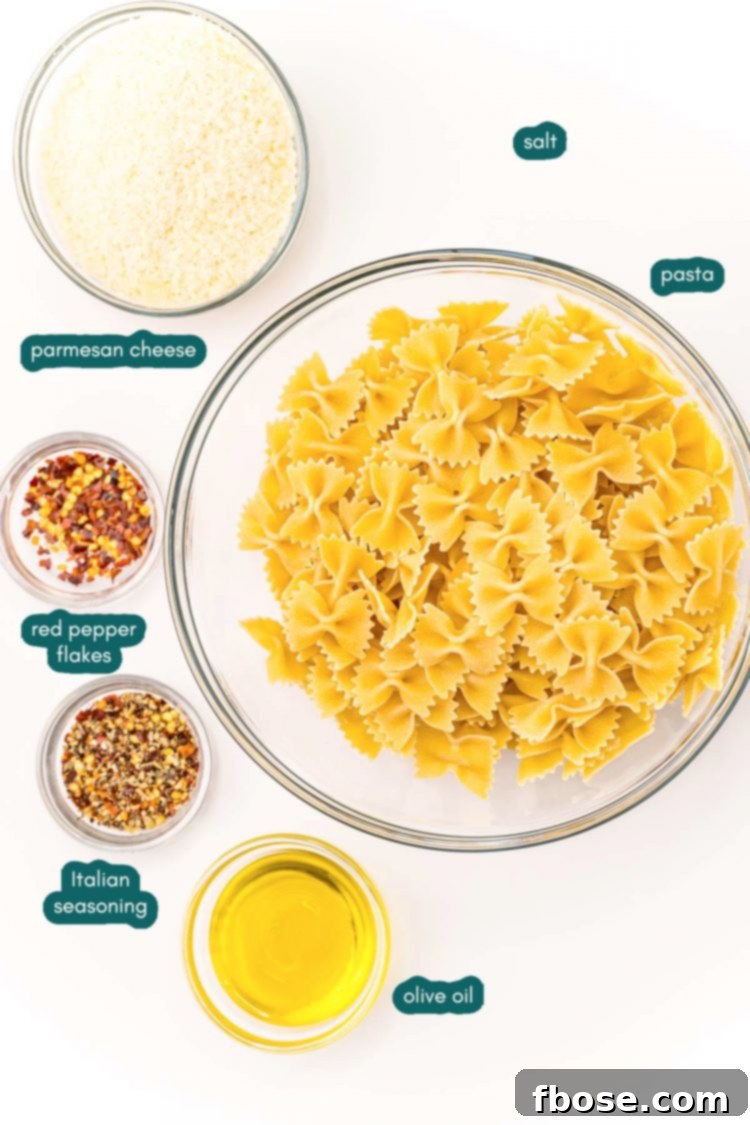 Overhead photo of ingredients to make pasta chips prepped on a white wood table.