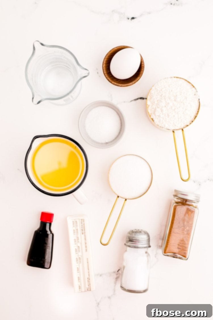Ingredients to prepare churros on a marble counter.