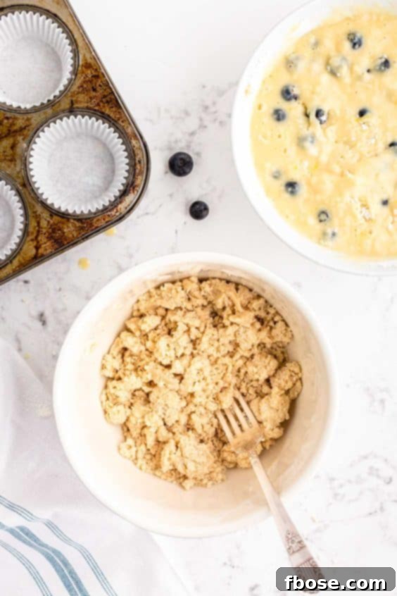 Ingredients to make streusel in a bowl being mixed.