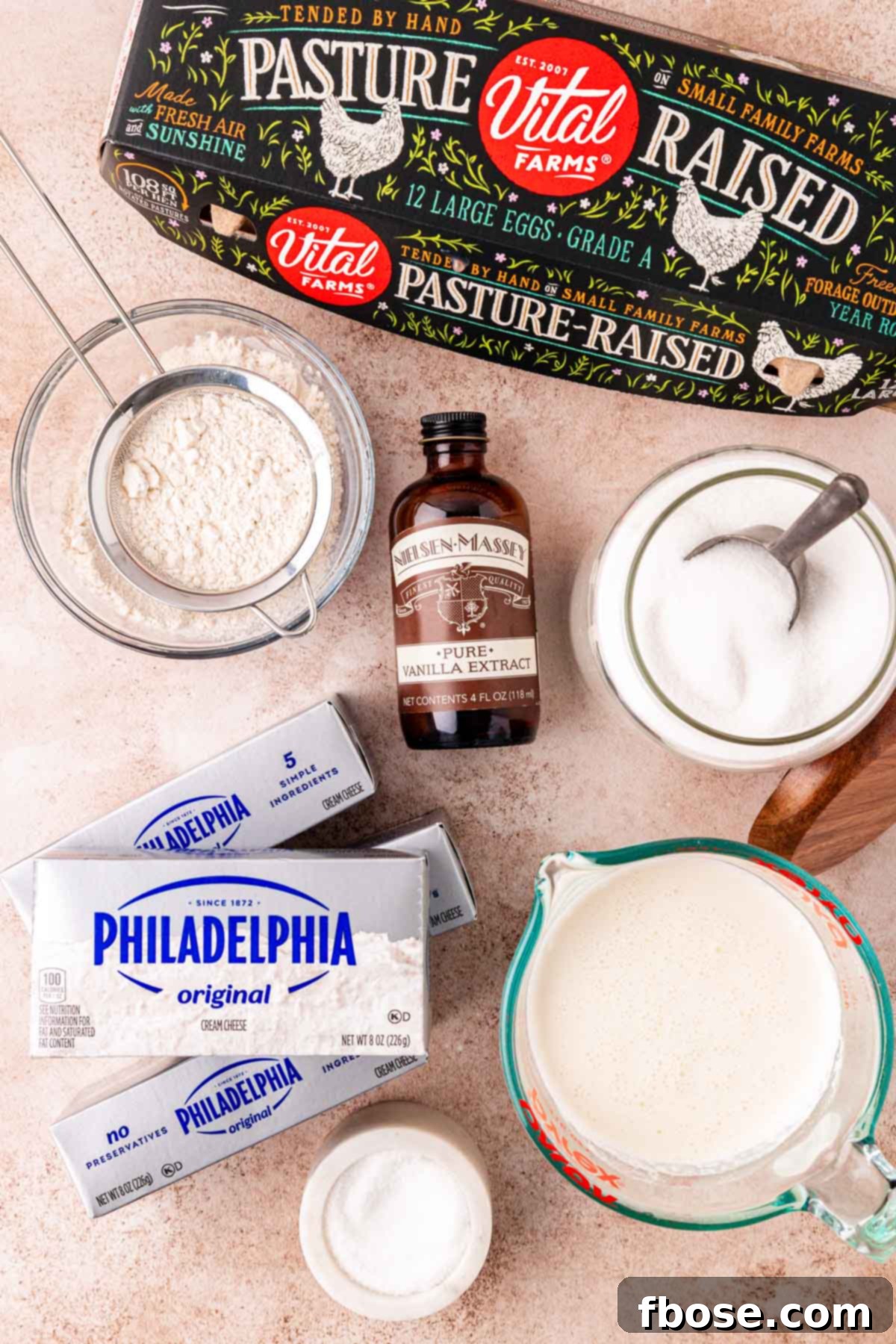 Overhead photo of ingredients to make basque cheesecake on a table.