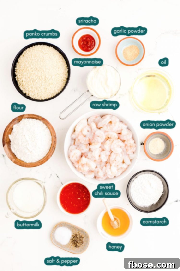 Overhead photo of ingredients prepped to make bang bang shrimp on a white marble surface.