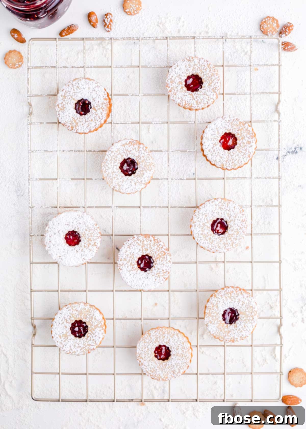 Berry-Filled Linzer Delights 14 Overhead photo of linzer cookies on a wire rack.