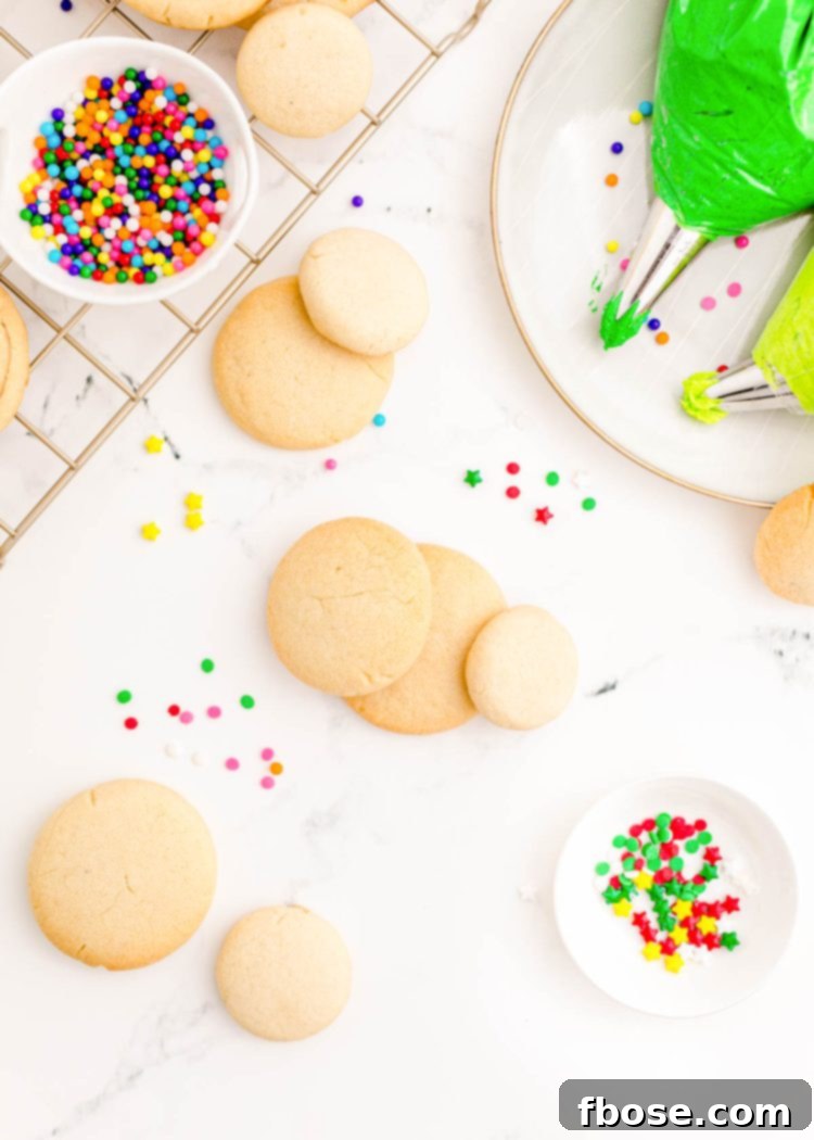 Festive Fir Tree Treats 10 A collection of perfectly baked sugar cookies, poised and ready to be decorated and transformed into festive Christmas trees with vibrant green frosting.