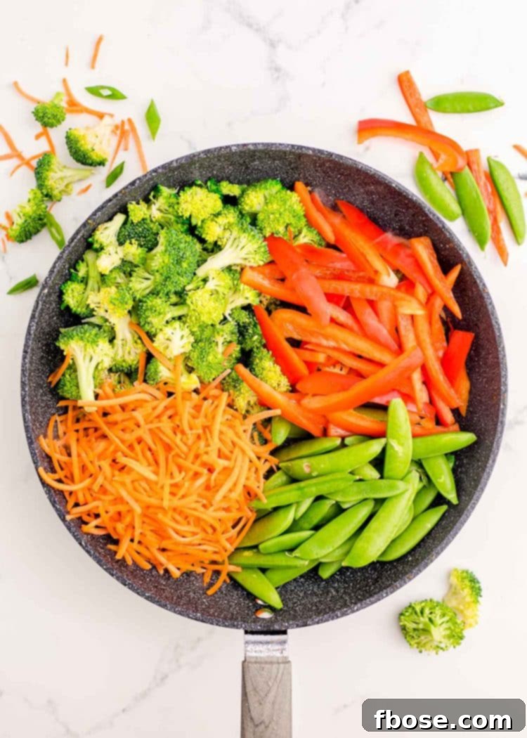 Vegetables cut up in a pan.