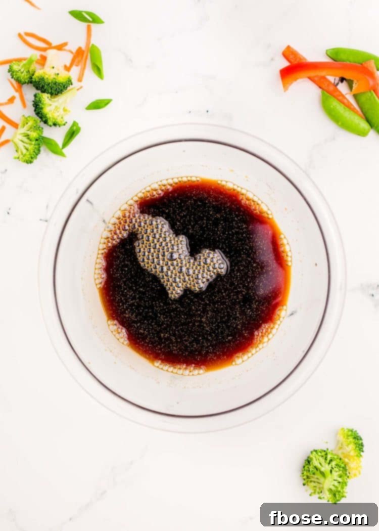 Beef stir fry sauce mixed up in a glass bowl.