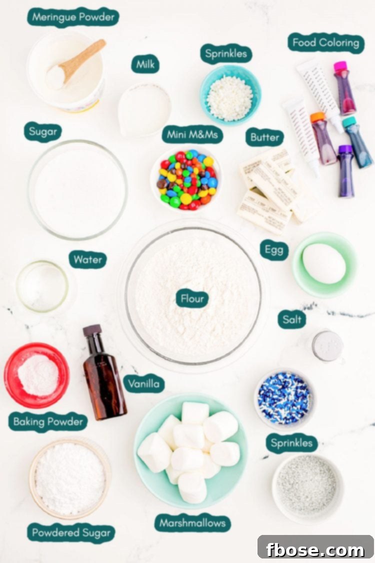 Melty Snowman Cookies 4 overhead photo of ingredients prepped to make melted snowman cookies on a marble surface, including butter, sugar, flour, egg, milk, vanilla, baking powder, salt, marshmallows, gel food coloring, sprinkles, M&M Minis, and Pull and Peel Twizzlers.
