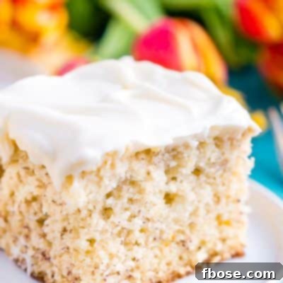 This is the Best Banana Cake recipe EVER! It's moist and sweet and topped with a tangy cream cheese frosting!