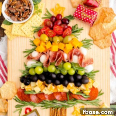 Overhead photo of a Christmas Tree Charcuterie board on a wooden table.