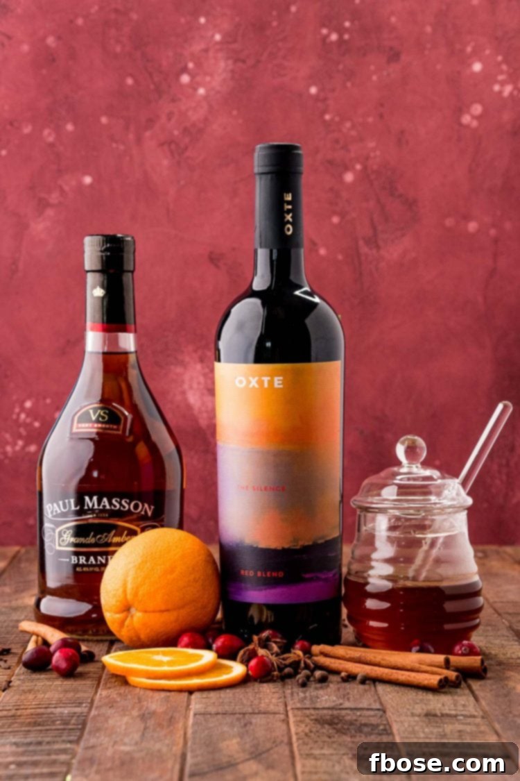 Ingredients to make Mulled Wine on a wooden table.