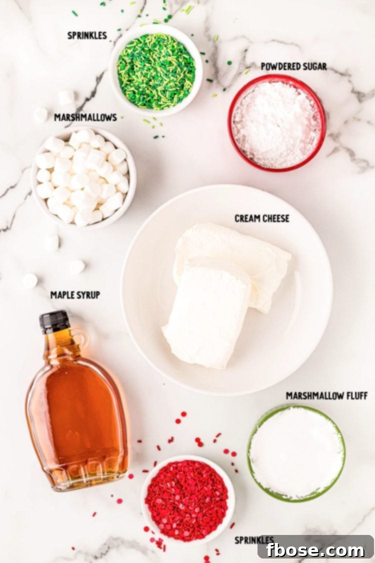 Overhead photo of ingredients to make elf inspired Christmas dip on a marble surface.