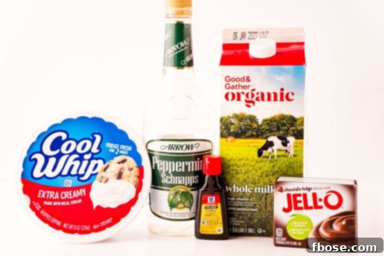 Close up photo of ingredients to make peppermint chocolate pudding shots on a white table.