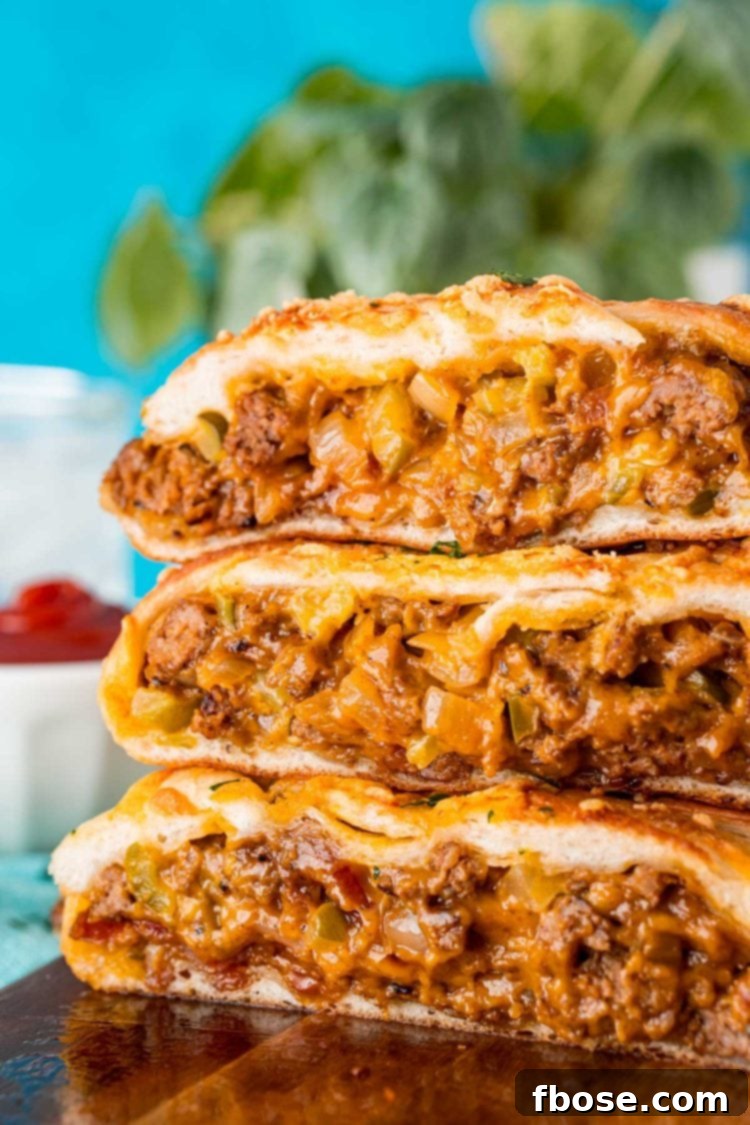 Easy Loaded Bread 2 Slices of garbage bread stacked on top of each other on a wooden board.
