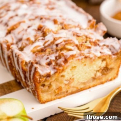 Close up photo of Apple Fritter Bread on a wood and marble cutting board.