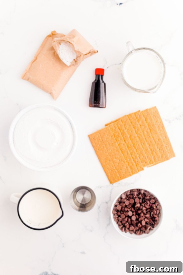 Ingredients to make Eclair Icebox Cake on a marble surface.