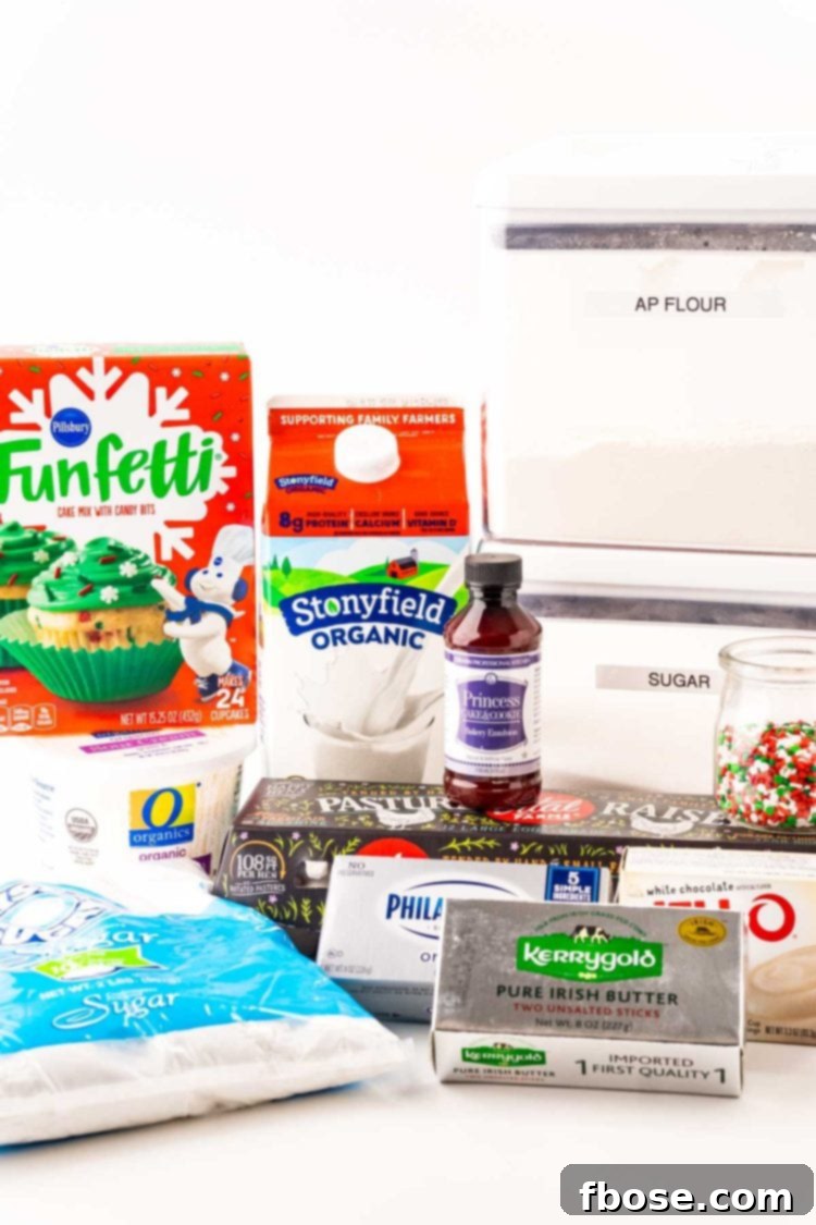 Yuletide Delight 4 Ingredients to make Christmas Cake on a white surface.
