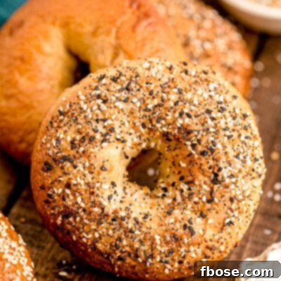 Close up photo of homemade everything bagels on a wooden table.