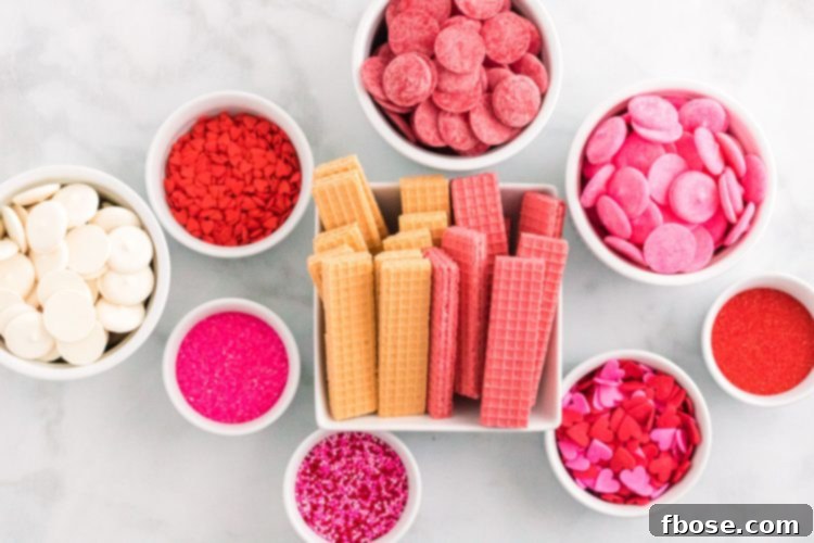 Sweetheart Wafer Layers 4 Ingredients to make Valentine's Day dipped sugar wafers on a marble counter.