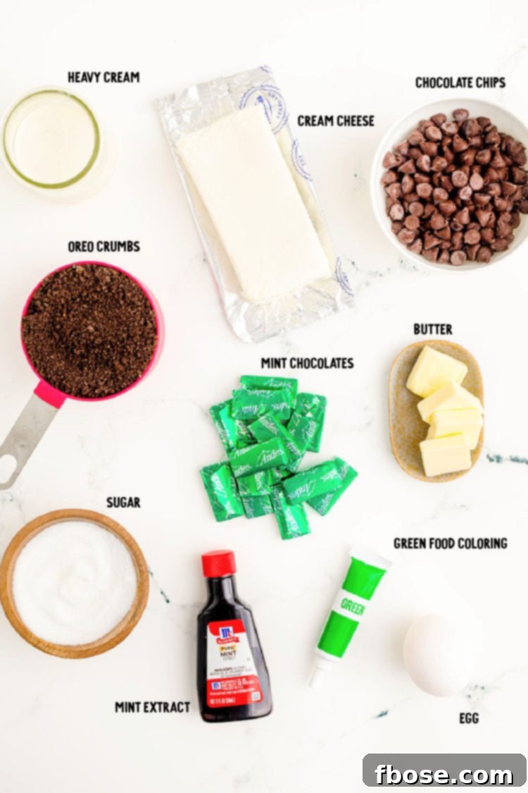 Mint Chocolate Oreo Cheesecakes 4 Ingredients to make mint chocolate cheesecakes on a marble surface.