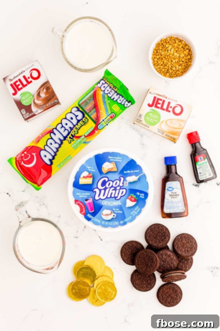Ingredients to make St Patrick's Day Pudding Cups on a marble surface.